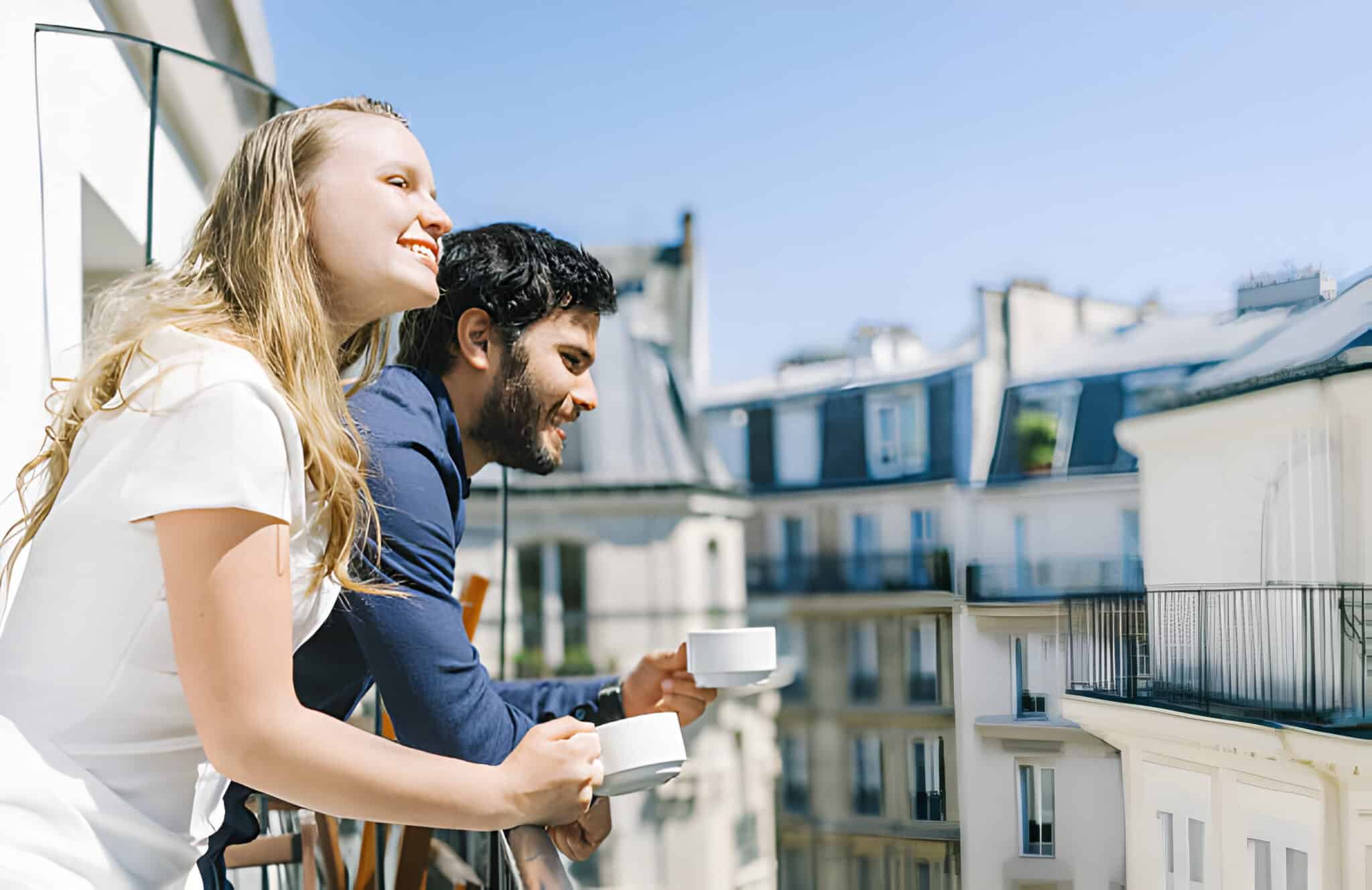 Young cute well-dressed couple are enjoying their breakfast