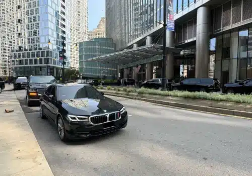 Luxury Black Sedan and SUV on Road