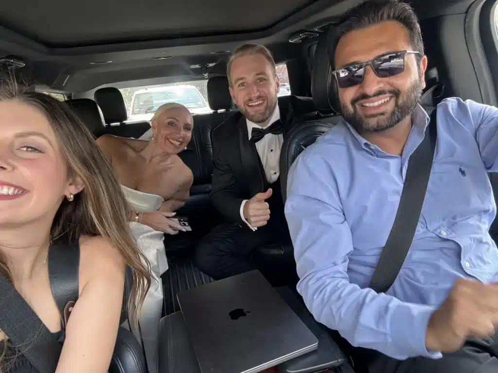 Chauffeur with Wedding Couple