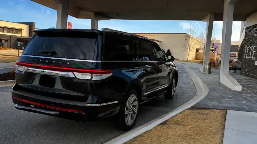 Luxury SUV at hotel entrance