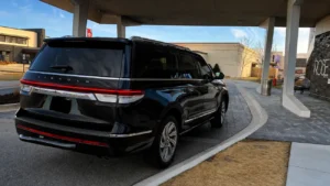 Luxury SUV at hotel entrance